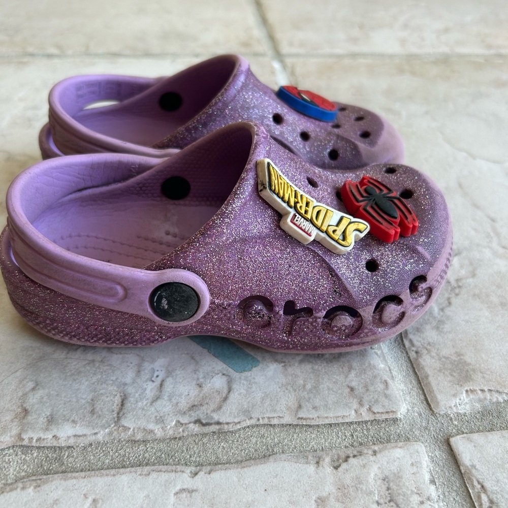 Toddler purple sparkle crocs with spiderman jibbitz. Size 10